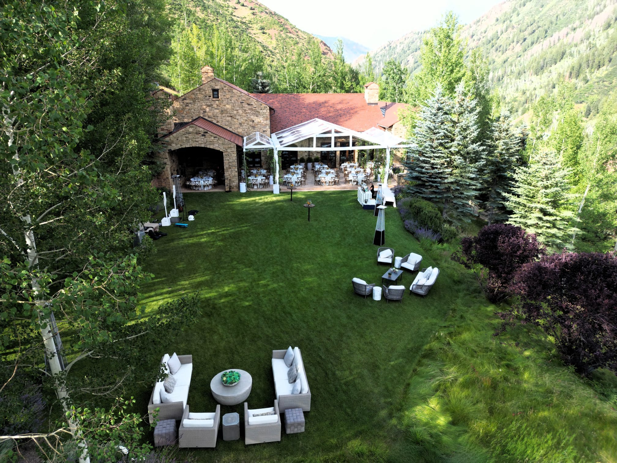 outdoor wedding reception with furniture on lawn